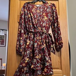 Floral long sleeve deep V neck line dress with belt with a slit ruffle skirt